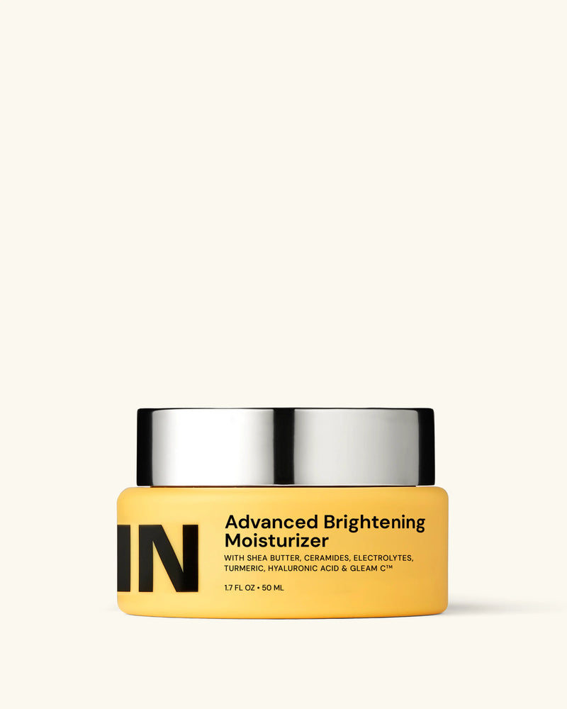 Advanced Brightening Moisturizer jar with sleek silver lid and bold label. Enriched with ceramides, turmeric, and hyaluronic acid for glowing skin.