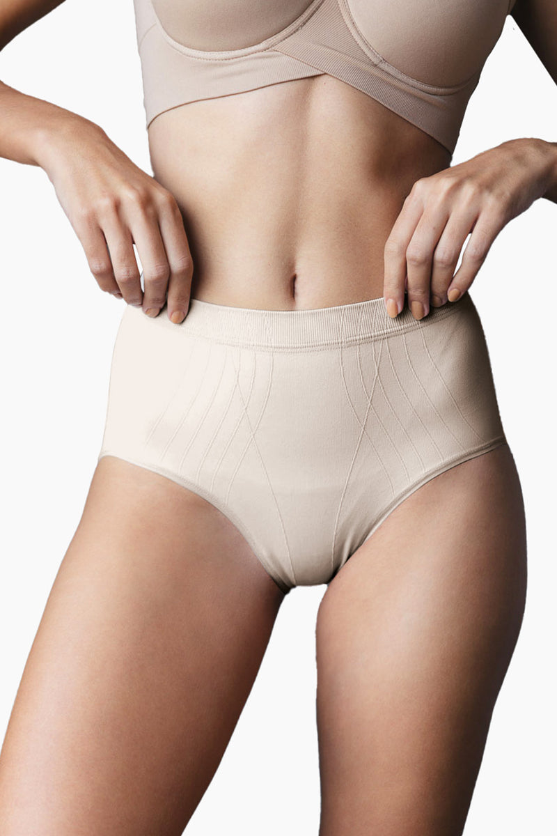 Contouring High-Leg Brief in beige with high waistband and seamless shaping lines for moderate compression and comfort.