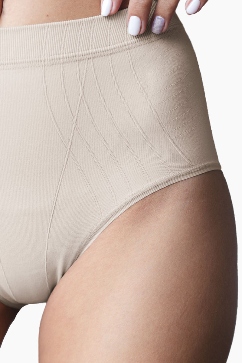 Close-up of beige Contouring High-Leg Brief highlighting seamless texture and contouring lines for a smooth, flattering fit.