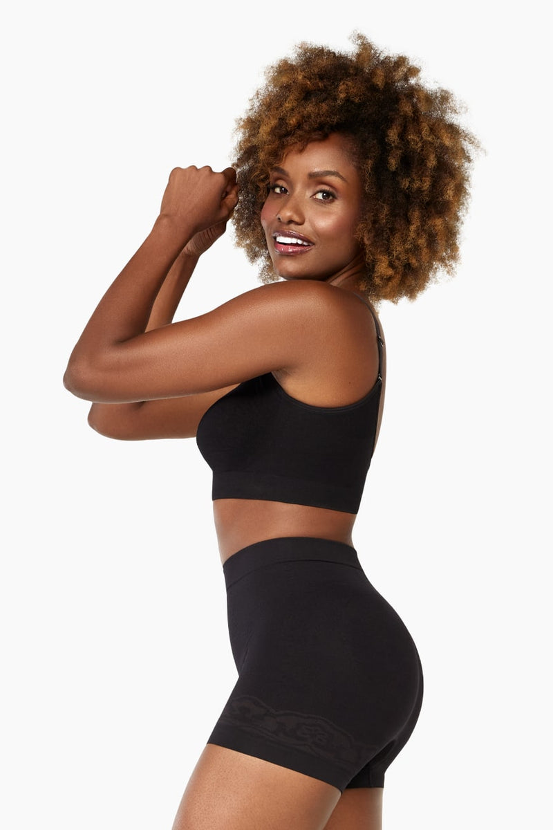 Side profile of model in black Curveez Boyshorts for Women showing hip control and smooth shaping fit.