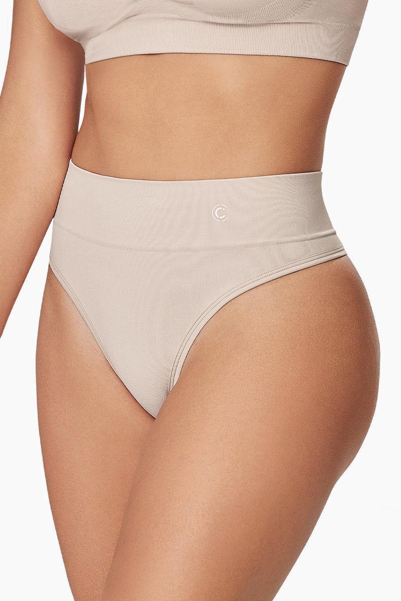 Pure Shape Thong shapewear in black with seamless design and moderate tummy control for a smooth silhouette. Ideal for everyday wear under clothing.