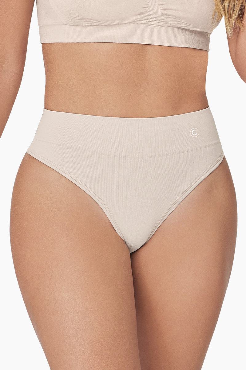 Pure Shape Thong shapewear in black with seamless design and moderate tummy control for a smooth silhouette. Ideal for everyday wear under clothing.